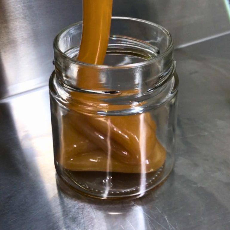 honey going into a jar